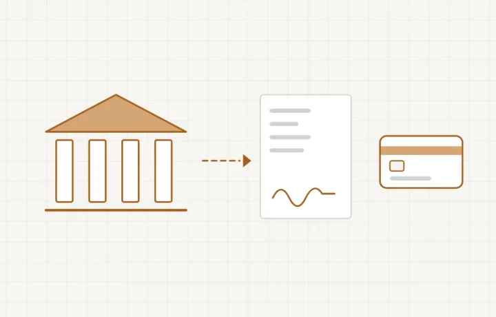 Un contrat déroulé entre une main qui signe et un bâtiment de banque, avec une carte bancaire qui passe entre les deux